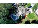 Aerial view of home with a private outdoor living space including a pool, spa, and patio at 2996 Walkin Horse Trl, Buford, GA 30519