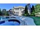 Backyard view featuring a pool, mature trees, and patio seating at 2996 Walkin Horse Trl, Buford, GA 30519