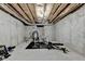 Unfinished basement area with exposed ceiling and concrete walls, and fitness equipment at 2996 Walkin Horse Trl, Buford, GA 30519