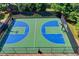 Overhead shot of the community basketball court, enclosed with a black metal fence at 2996 Walkin Horse Trl, Buford, GA 30519