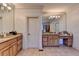 Bright bathroom with double vanities, granite countertops and tiled floors at 2996 Walkin Horse Trl, Buford, GA 30519