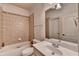 Neutral bathroom with a shower-tub combo, ceramic tile, and vanity at 2996 Walkin Horse Trl, Buford, GA 30519
