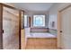A lavish bathroom features a glass-enclosed shower and a separate soaking tub at 2996 Walkin Horse Trl, Buford, GA 30519