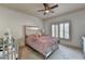 Cozy bedroom with a modern mirrored bed frame, crib, and window with shutters at 2996 Walkin Horse Trl, Buford, GA 30519