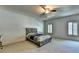 Minimalist bedroom featuring a wooden bed frame and neutral-toned walls at 2996 Walkin Horse Trl, Buford, GA 30519