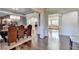 Open dining room, features a large dining table and hardwood flooring at 2996 Walkin Horse Trl, Buford, GA 30519