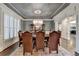 Formal dining room with chandelier, large table, and wood floors at 2996 Walkin Horse Trl, Buford, GA 30519