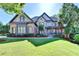 Beautiful two-story home with manicured lawn, stone accents, and a welcoming front porch at 2996 Walkin Horse Trl, Buford, GA 30519