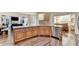 A kitchen island with wood cabinets, granite countertop, a sink, and stainless steel dishwasher at 2996 Walkin Horse Trl, Buford, GA 30519