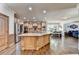 Gourmet kitchen features a large island, stainless steel appliances, and an open dining area at 2996 Walkin Horse Trl, Buford, GA 30519