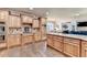 Modern kitchen with stainless steel appliances, wood cabinets, and a central island at 2996 Walkin Horse Trl, Buford, GA 30519