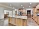 Spacious kitchen features wood floors, a large island, and stainless steel appliances at 2996 Walkin Horse Trl, Buford, GA 30519