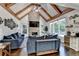 Vaulted living room features a stone fireplace, ceiling fan and an abundance of natural light at 2996 Walkin Horse Trl, Buford, GA 30519