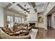 Inviting living room with a cozy fireplace, elegant furnishings, and a decorative coffered ceiling at 2996 Walkin Horse Trl, Buford, GA 30519