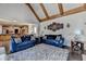 Spacious living room with hardwood floors and vaulted ceiling with wooden beams at 2996 Walkin Horse Trl, Buford, GA 30519