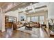 Spacious living room featuring a fireplace, coffered ceilings and luxury sofas at 2996 Walkin Horse Trl, Buford, GA 30519