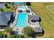 Aerial view of a community pool, playground, tennis court, and outdoor sport court at 2996 Walkin Horse Trl, Buford, GA 30519