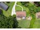 Birds-eye view displays a lovely property with sprawling lawn, charming home with patio, and winding driveway at 388 Talcott Nw Cir, Marietta, GA 30064