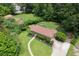 Aerial view of a well-maintained property featuring a cozy home, landscaped yard, and a long winding driveway at 388 Talcott Nw Cir, Marietta, GA 30064