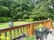 Inviting back deck with potted plants, providing a relaxing outdoor space overlooking the expansive, lush backyard at 388 Talcott Nw Cir, Marietta, GA 30064