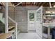 Unfinished basement featuring a cement block wall, open door, and access to the backyard at 388 Talcott Nw Cir, Marietta, GA 30064