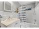 Bright bathroom with white tiles, vanity, tub, and shower combination at 388 Talcott Nw Cir, Marietta, GA 30064