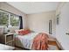 Inviting bedroom with a cozy bed, panel walls, and serene natural light at 388 Talcott Nw Cir, Marietta, GA 30064