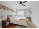 Bright bedroom featuring a ceiling fan, wood floors, white walls, and natural light at 388 Talcott Nw Cir, Marietta, GA 30064