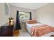 Cozy bedroom featuring panel walls, natural light, and a comfortable single bed at 388 Talcott Nw Cir, Marietta, GA 30064