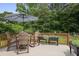 Outdoor deck features a dining table, chairs, and planters, perfect for entertaining at 388 Talcott Nw Cir, Marietta, GA 30064