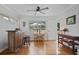 Bright dining area with hardwood floors, table and chairs, and a bar overlooking a patio at 388 Talcott Nw Cir, Marietta, GA 30064