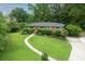 Charming single-story brick home with a well-manicured lawn and inviting curb appeal at 388 Talcott Nw Cir, Marietta, GA 30064