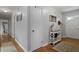Hallway view featuring hardwood floors, light gray walls, a console table and two doorways at 388 Talcott Nw Cir, Marietta, GA 30064