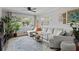 Comfortable living room featuring a plush sectional sofa, large windows, and stylish decor at 388 Talcott Nw Cir, Marietta, GA 30064