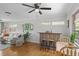 Open living area with hardwood floors, bar, table, sectional couch, and lots of natural light at 388 Talcott Nw Cir, Marietta, GA 30064