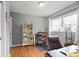 Home office with wood floors, natural light, and comfortable seating area at 388 Talcott Nw Cir, Marietta, GA 30064