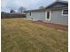 The backyard includes a brick patio and grass at 487 Eastside Dr, Dacula, GA 30019