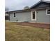 The backyard features a brick patio and green space at 487 Eastside Dr, Dacula, GA 30019