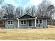 Charming single-story home with a gray exterior, white trim, and a well-manicured front lawn at 487 Eastside Dr, Dacula, GA 30019