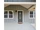 Welcoming front porch with stylish door and white framed windows, offering curb appeal and inviting entry at 487 Eastside Dr, Dacula, GA 30019