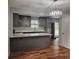 Elegant kitchen with gray cabinets, white quartz countertops, and new appliances, ideal for cooking at 487 Eastside Dr, Dacula, GA 30019