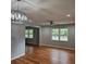 Bright living room featuring refinished hardwood floors and updated fixtures at 487 Eastside Dr, Dacula, GA 30019