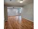 Open-concept living area with hardwood flooring and a view of the backyard, great for entertaining at 487 Eastside Dr, Dacula, GA 30019