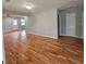 Spacious living room with hardwood floors and neutral walls, offering a versatile living space at 487 Eastside Dr, Dacula, GA 30019