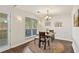 Bright dining room with a chandelier at 1615 Nw Vinebrook Nw Ter, Kennesaw, GA 30144