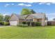 Charming single-story home with well-manicured lawn and attached two-car garage at 1615 Nw Vinebrook Nw Ter, Kennesaw, GA 30144
