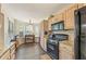 Full kitchen view showcasing breakfast nook, granite countertops, and stainless steel appliances at 1615 Nw Vinebrook Nw Ter, Kennesaw, GA 30144