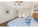 Primary bedroom with hardwood floors and tray ceiling at 1615 Nw Vinebrook Nw Ter, Kennesaw, GA 30144