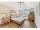 Primary bedroom with hardwood floors and tray ceiling at 1615 Nw Vinebrook Nw Ter, Kennesaw, GA 30144