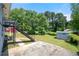 Expansive backyard featuring lush greenery, a storage shed, and a quaint staircase, perfect for outdoor enjoyment at 1985 Thomasville Se Dr, Atlanta, GA 30315